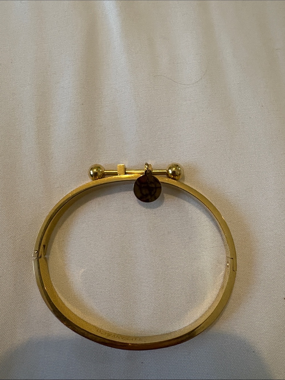 Gold-Tone Hinged Bangle Bracelet with Charm